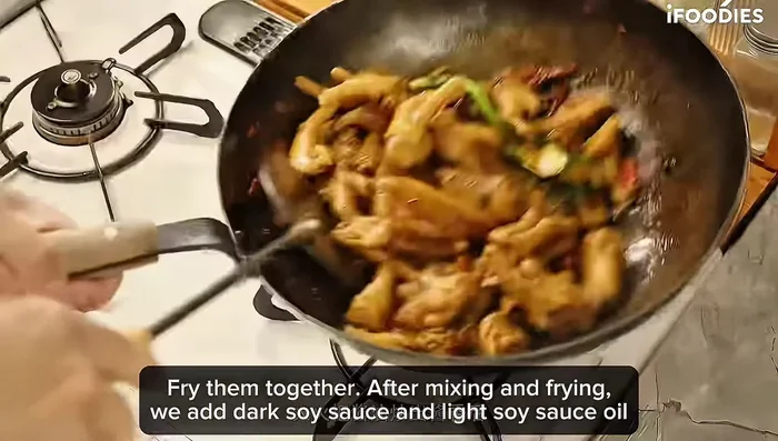 Add dark soy sauce, light soy sauce, beer, and hot water (enough to cover chicken feet).