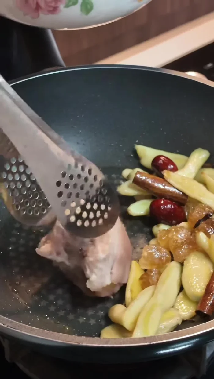 Add the blanched pork trotters to the pot.