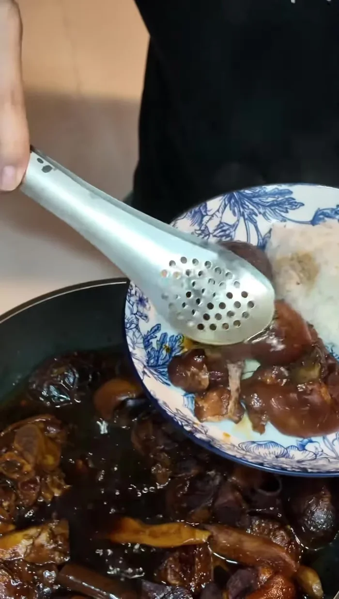 Serve the tender pork trotters with the braising sauce over rice.