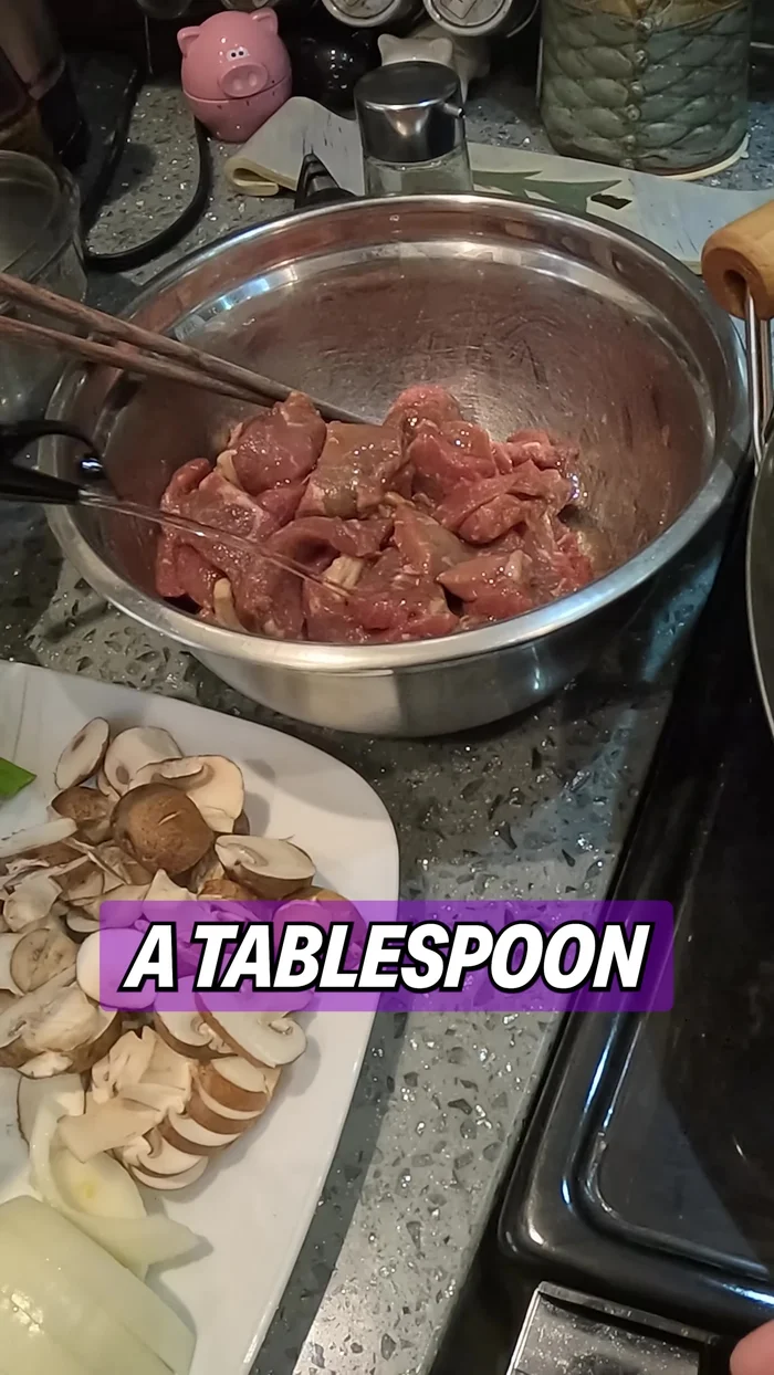 Add cooking oil to the beef marinade and mix.