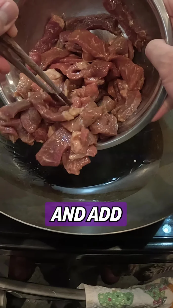 Add cooking oil to the pan and add the marinated beef. Stir-fry for about 2 minutes, then set aside.
