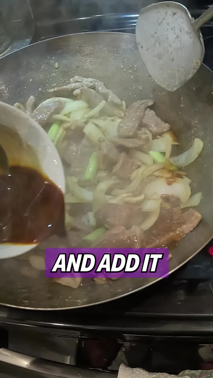 Add the sauce mixture to the pan. Add the green parts of the green onions and stir until everything is evenly coated.