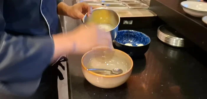 Prepare the batter: In a mixing bowl, combine cornflour, flour, a little beaten egg, and salt. Add water to achieve a smooth, soft consistency.