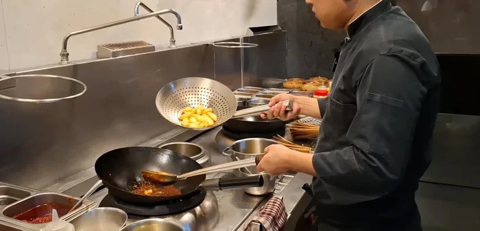 Add the fried eggs to the sauce and toss gently to coat.