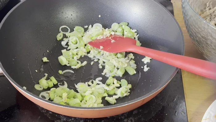 Add all the prepared vegetables (carrots, cabbage, capsicum) and mix well.
