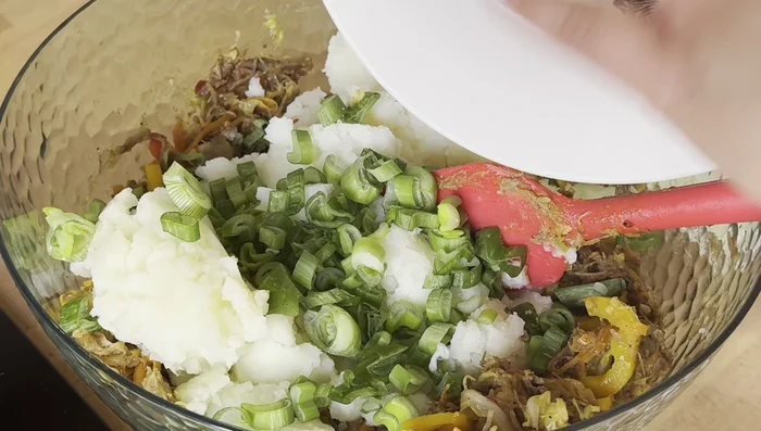 Add the remaining green onions and mix.
