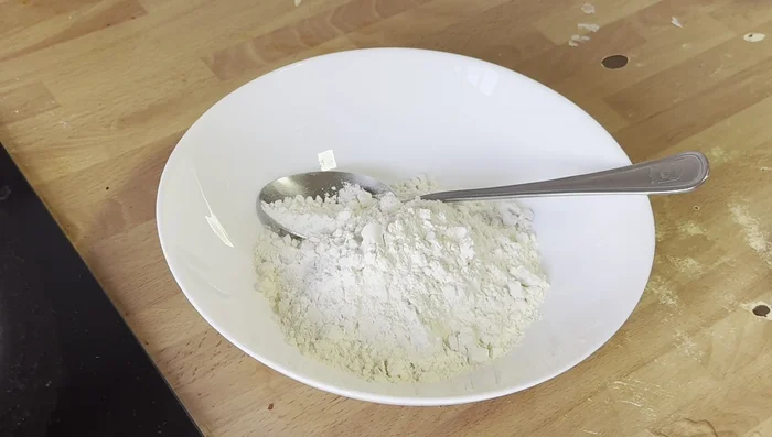 Prepare a slurry by mixing 1/2 cup of flour, 1 teaspoon crushed red chili, 1/4 teaspoon salt, and water until you get the desired consistency.
