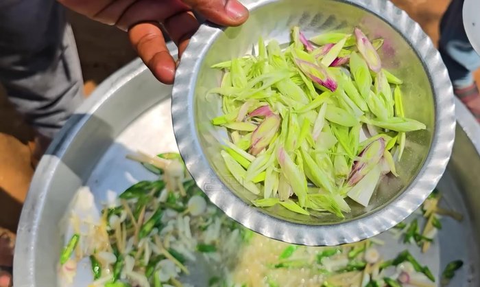 Add the chopped onions and scallions and stir-fry until softened.