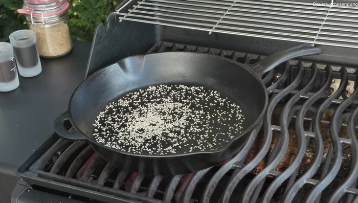 Toast the sesame seeds in the hot cast iron pan until fragrant. Set aside.