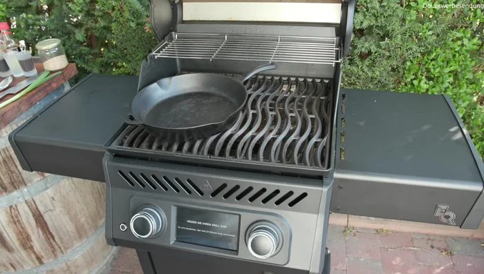 Preheat the grill with a cast iron pan on one burner.