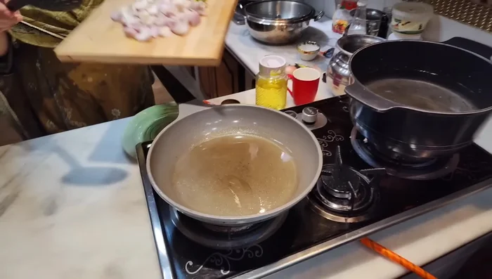Lightly fry the onions and capsicums in a frying pan for 10-15 minutes until slightly shiny, stirring occasionally. Set aside.