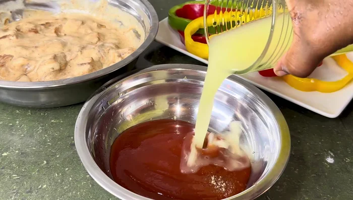 Prepare the sweet and sour sauce: In a bowl, combine sugar, ketchup, pineapple juice, vinegar, and dark soy sauce. Mix well.