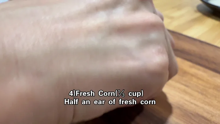 Cut corn kernels off the cob.