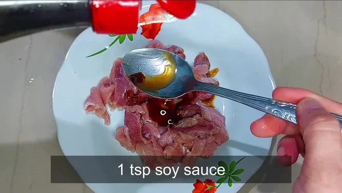 Marinate the beef using the velveting technique: Mix with oyster sauce, soy sauce, sesame oil, white pepper, cornstarch, and beaten egg. Let it marinate for 15 minutes.