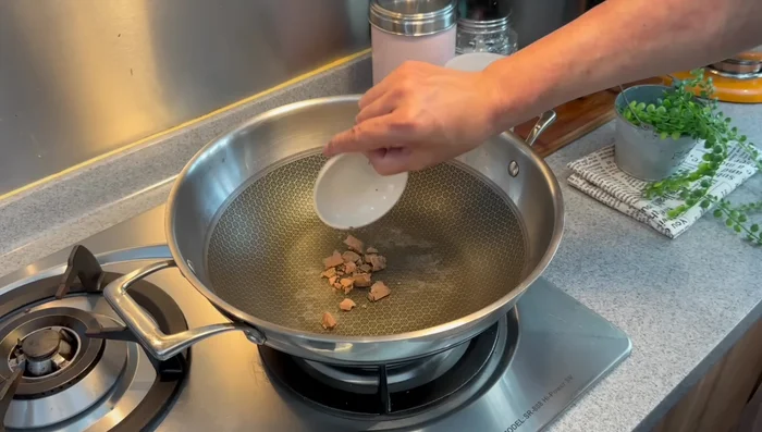 Dry fry balachan: Dry roast balachan until it crumbles. (171.28)