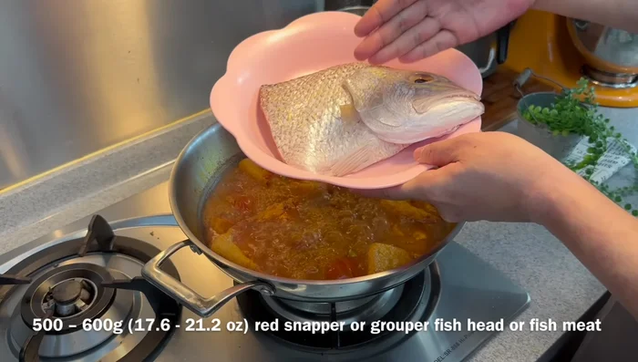 Add fish head and okra; cook for another 12-15 minutes. (395.72)