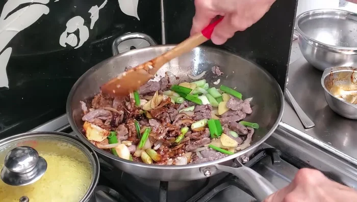 Pour in the prepared sauce and stir until well coated.