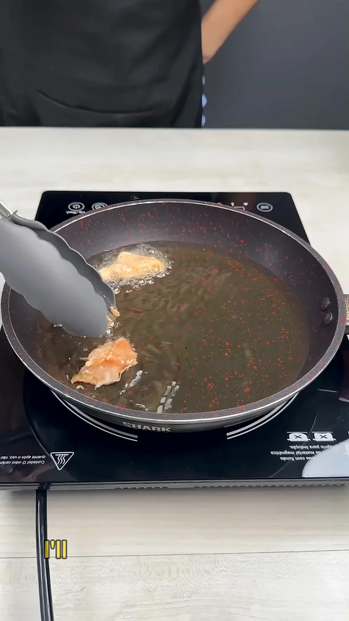 Fry the chicken pieces in a hot pan with oil until brown. Remove and set aside.