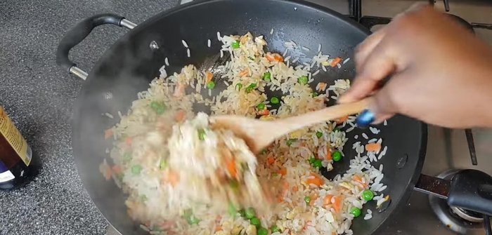 Stir in 1 tablespoon of dark soy sauce until well combined with the rice.