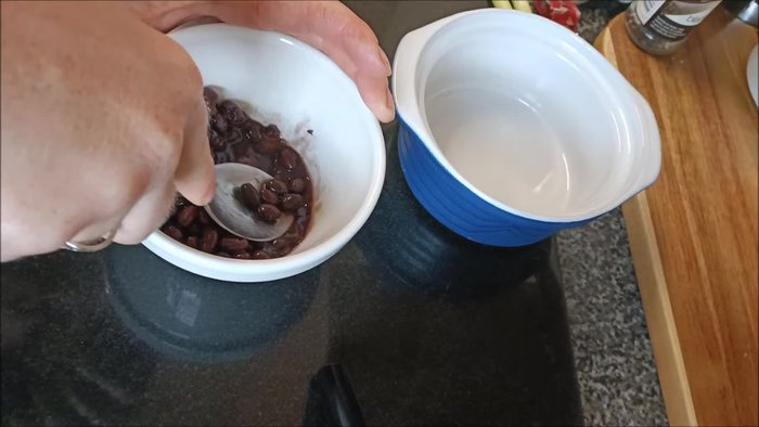 Roughly mash up three tablespoons of black beans.