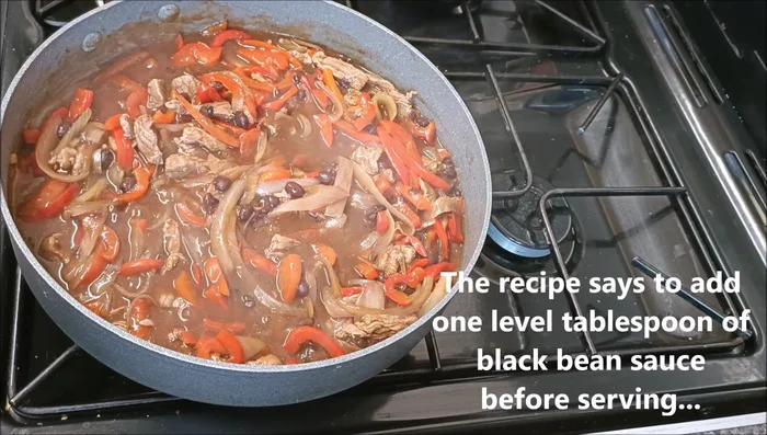 Add 1 level tablespoon of black bean sauce (or 1 oxo cube mixed in 4 tablespoons of water as a substitute) before serving.