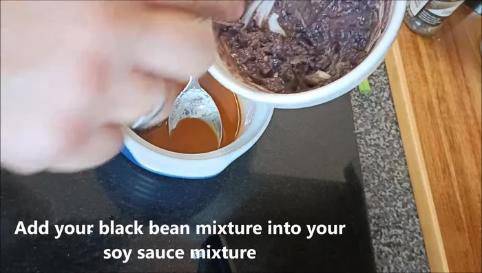 Add the black bean mixture to the soy sauce mixture and mix together.