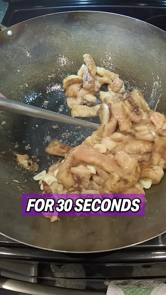 Add the blanched vegetables back into the wok and mix everything around. Add the sauce mixture to the wok and stir for 30 seconds until everything is evenly coated.