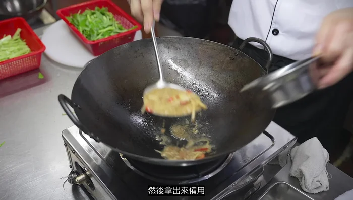 Continue stir-frying until the water spinach is tender-crisp and coated in the sauce.