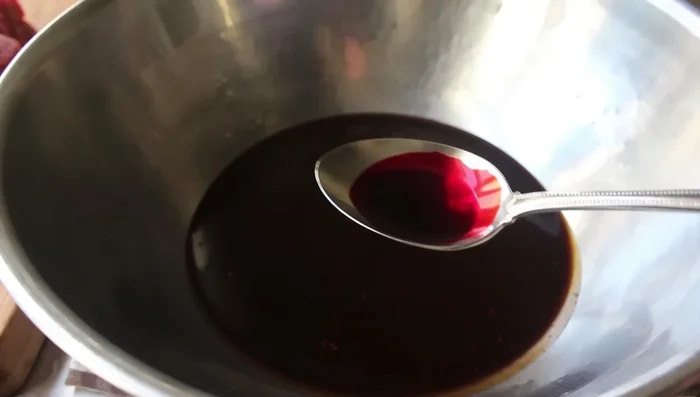 Add the optional red food coloring to the cooled sauce and mix well.