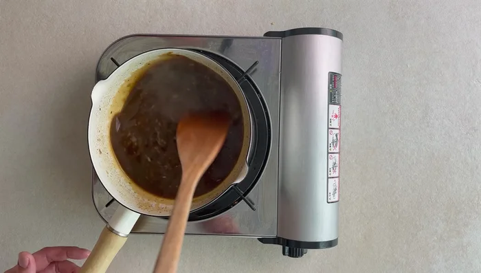Add oil to a hot pan. Fry the chicken until almost cooked through or until it changes color and separates.