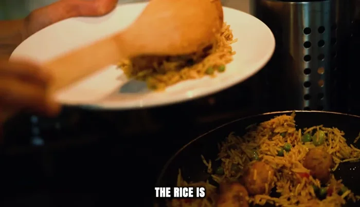 Fold everything together until the rice is evenly colored and fragrant. Taste and adjust seasoning.