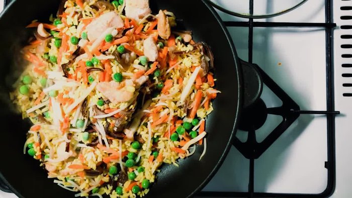 Rinse 2 cups of jasmine or long grain rice until the water runs clear. Cook with slightly less water than usual for fluffy grains.