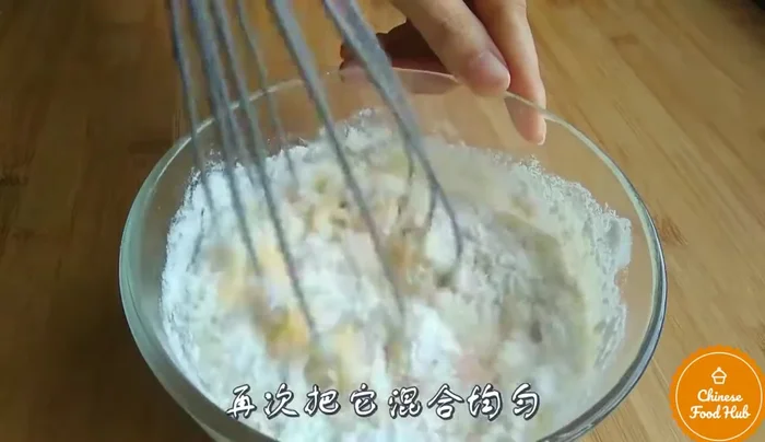 Bake the cake. (Note: Baking time and temperature are not specified.)