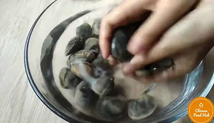 Add the clams to the wok. Stir-fry for several minutes, until they open. (Note: Discard any clams that do not open.)