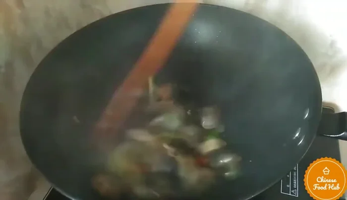 Add chopped spring onions. Stir-fry briefly to combine.