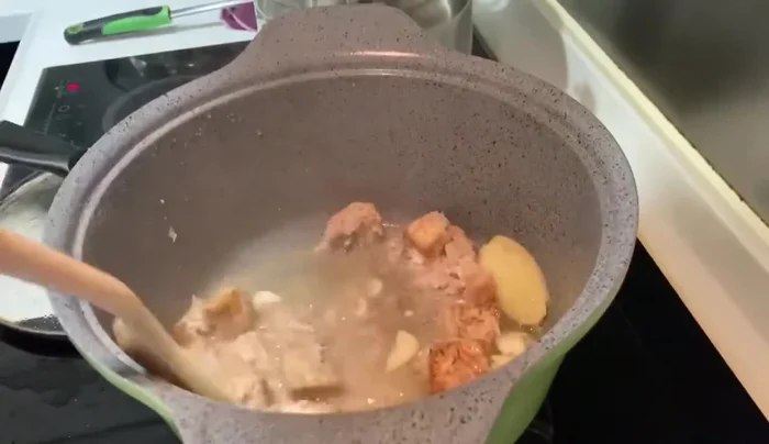 Simmer until the chicken and taro are cooked through.