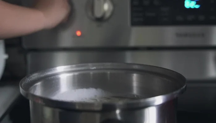 Heat a wok with oil over high heat. Test with a bit of cold water; if it sizzles, add pork. Reduce heat to medium-high.