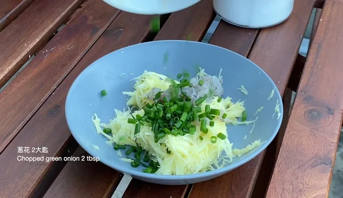 Drop spoonfuls of the potato mixture into the hot oil, flattening slightly to form pancakes.