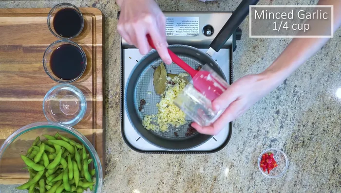 Add minced garlic and diced chilies (optional). Stir until fragrant.