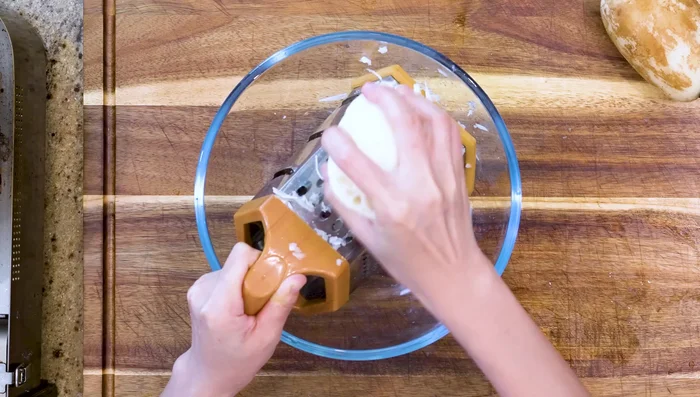 Crispy Pancake: Grate the lotus root. Mix with flour, soy sauce, hoisin sauce, salt, egg, diced scallions, and white pepper. Divide into 6 portions. Heat oil in a frying pan. Flatten each portion into a disc and fry for 2-3 minutes per side until golden brown.