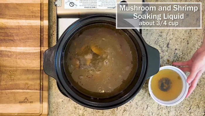 Pour in chicken stock and mushroom/shrimp soaking liquid. Bring to a boil.