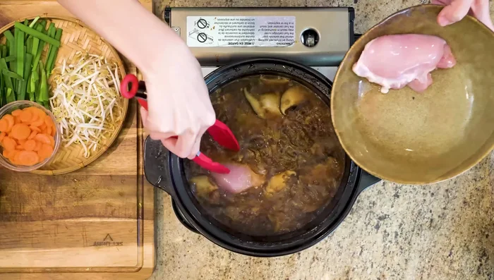 Add chicken thighs. Simmer on low heat for 20 minutes.