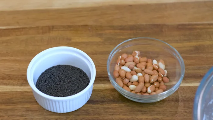 Toast peanuts and sesame seeds (if using raw). Let cool. Remove peanut skins if needed.