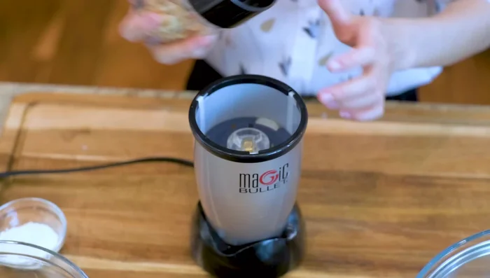 Blend toasted peanuts and sesame seeds. Mix with white sugar and 4 tsp of flour.