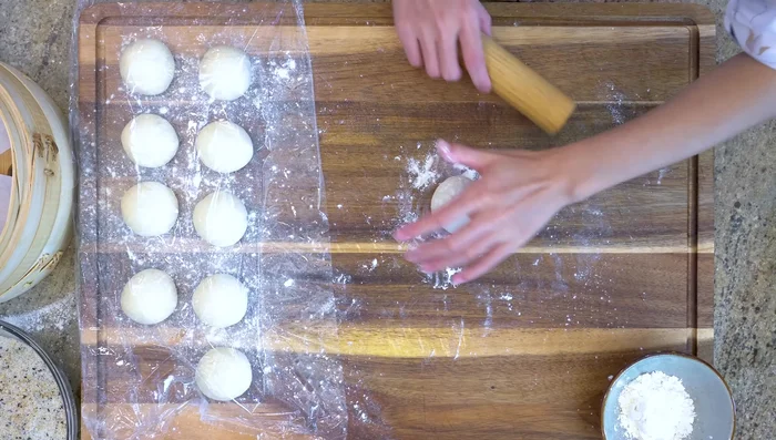 Roll each ball into a 4-inch diameter circle, making the edges thinner than the center.
