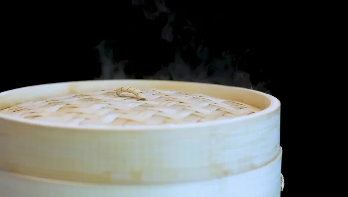 Steam over medium-low heat for 10 minutes after steam appears. Let sit for at least 5 minutes before opening.