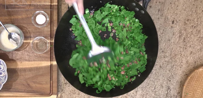 Add Choi Sum leaves: Toss in the Choi Sum leaves and stir until the volume decreases. Season with salt and pepper to taste.