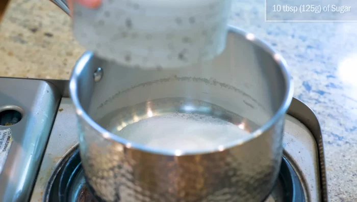 Caramelize sugar in a separate saucepan until golden brown.