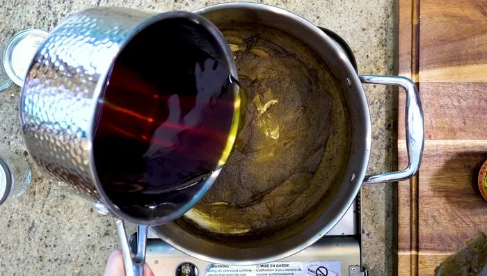 Combine the reduced oyster liquid with the caramel sugar solution.