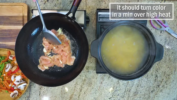 Stir-fry chicken over high heat until browned.